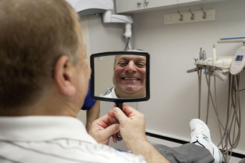 patient looking into mirror
