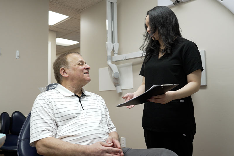 team member consulting with Patient