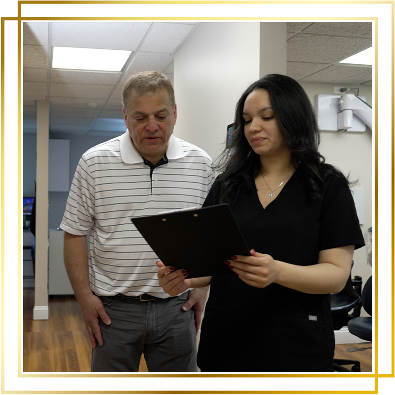 Team member going over financing of dental implants