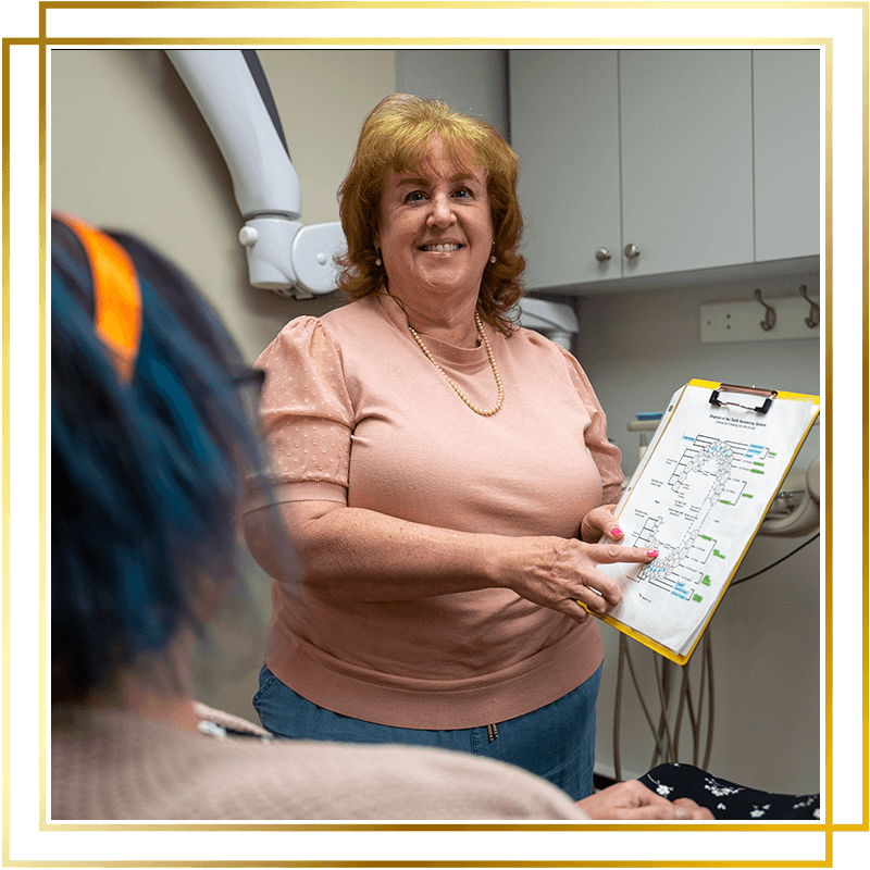 Team member going over paperwork with patient