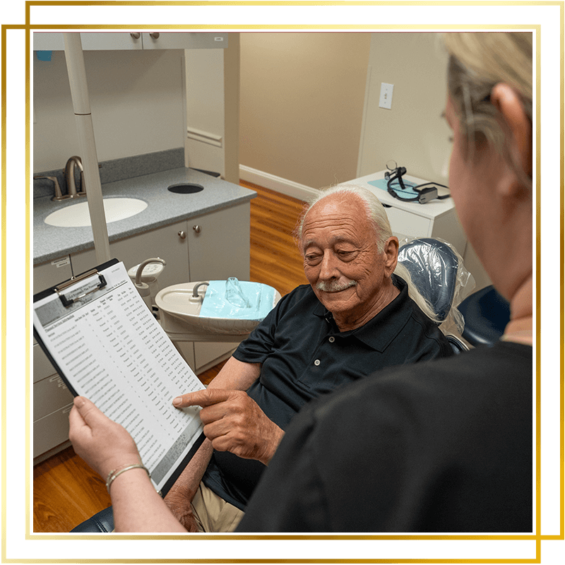 Team member going over paperwork with Patient