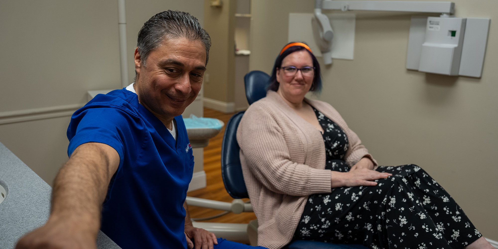 Dentist consulting with Patient